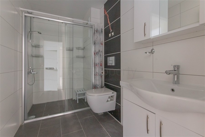 Трехкомнатная квартира в районе Махмутлар