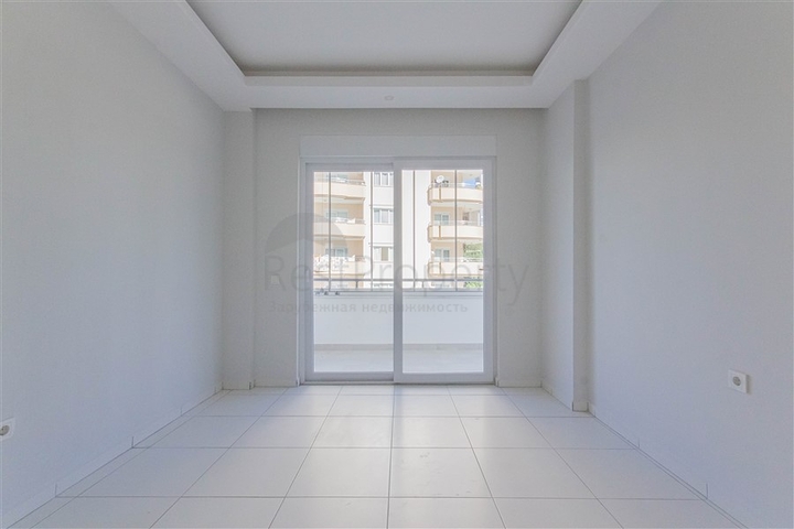 Трехкомнатная квартира в районе Махмутлар