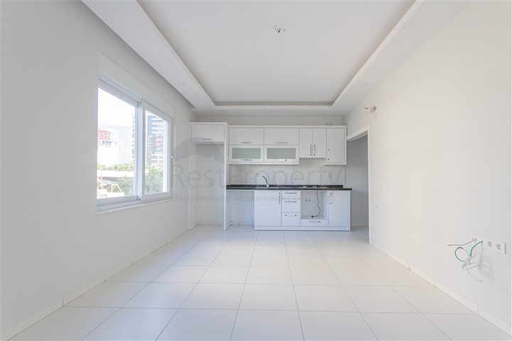 Трехкомнатная квартира в районе Махмутлар