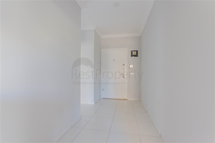 Трехкомнатная квартира в районе Махмутлар