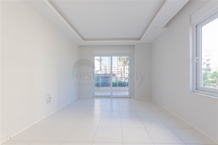 Трехкомнатная квартира в районе Махмутлар