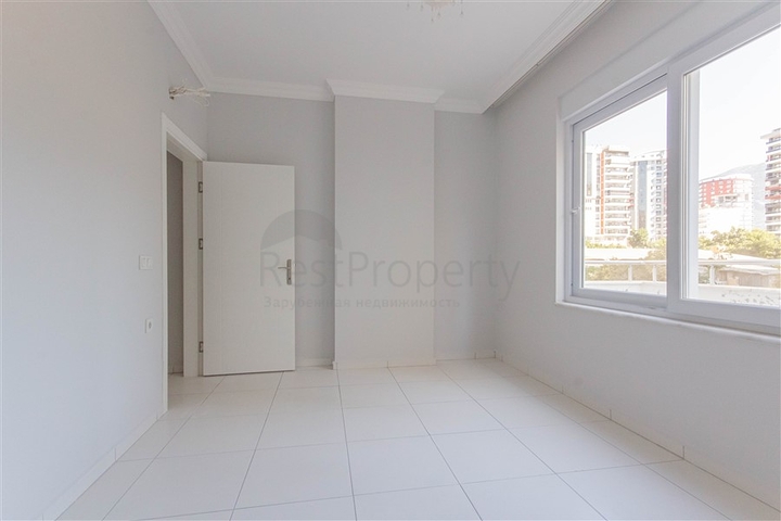 Трехкомнатная квартира в районе Махмутлар