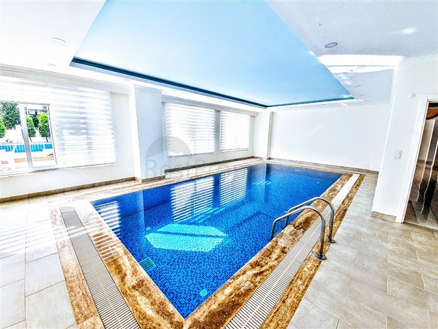 Трехкомнатная квартира в районе Махмутлар