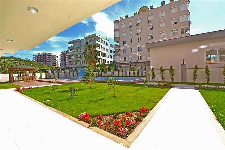 Трехкомнатная квартира в районе Махмутлар