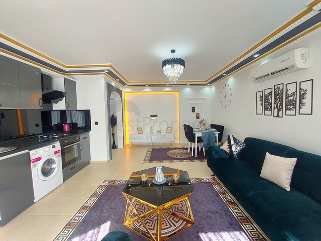 Трехкомнатная квартира в районе Махмутлар планировкой 2+1