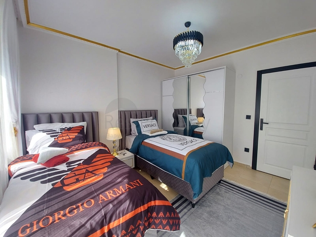 Трехкомнатная квартира в районе Махмутлар планировкой 2+1