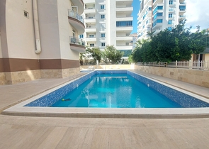 Трехкомнатная квартира в районе Махмутлар планировкой 2+1