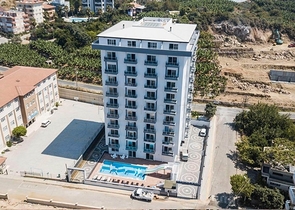 Меблированная квартира планировки 1+1 в 15 минутах от моря