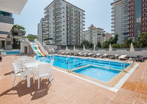 Меблированная квартира планировки 1+1 в 15 минутах от моря