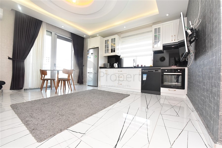 Просторная квартира на первой береговой линии в районе Махмутлар