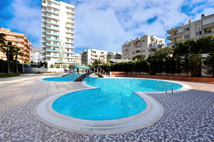 Просторная квартира на первой береговой линии в районе Махмутлар