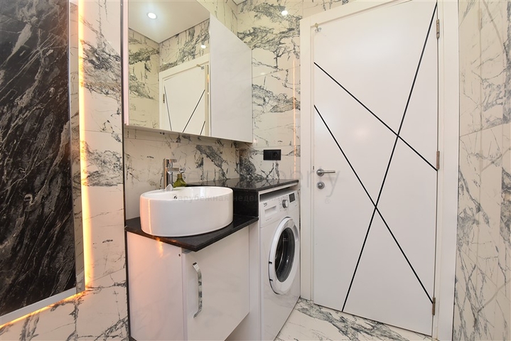 Просторная квартира на первой береговой линии в районе Махмутлар