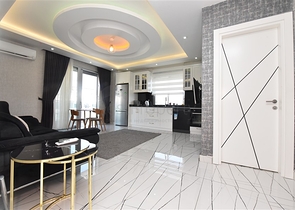 Просторная квартира на первой береговой линии в районе Махмутлар