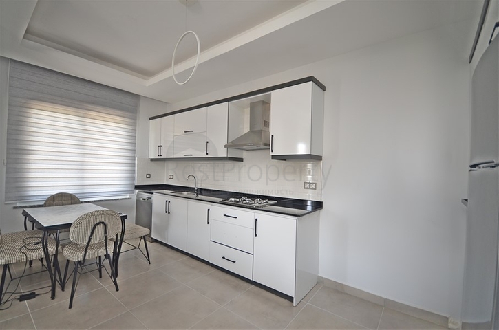 Трехкомнатная квартира в районе Махмутлар