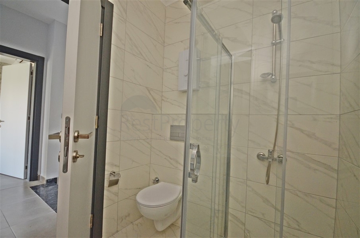 Трехкомнатная квартира в районе Махмутлар