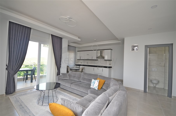 Трехкомнатная квартира в районе Махмутлар