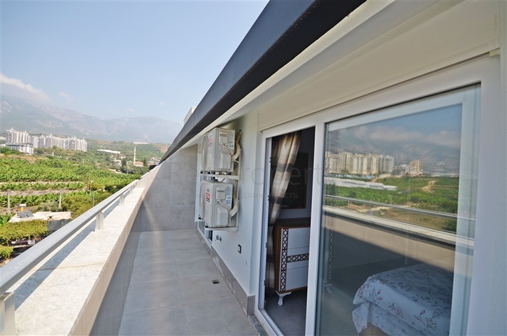 Трехкомнатная квартира в районе Махмутлар