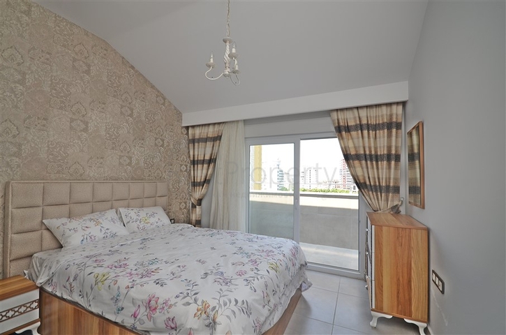 Трехкомнатная квартира в районе Махмутлар