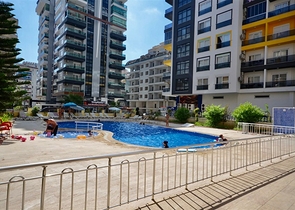 Просторная квартира 3+1 с мебелью и техникой в районе Махмутлар 