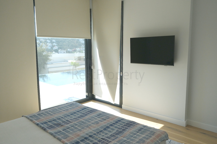 Одноэтажная вилла с террасой и бассейном в уютном комплексе в районе Яалыкавак