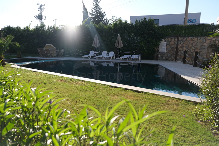 Дуплекс 2+1 с террасой и садом в центральной части Бодрума в шаговой доступности к морю