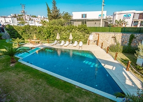 Дуплекс 2+1 с террасой и садом в центральной части Бодрума в шаговой доступности к морю