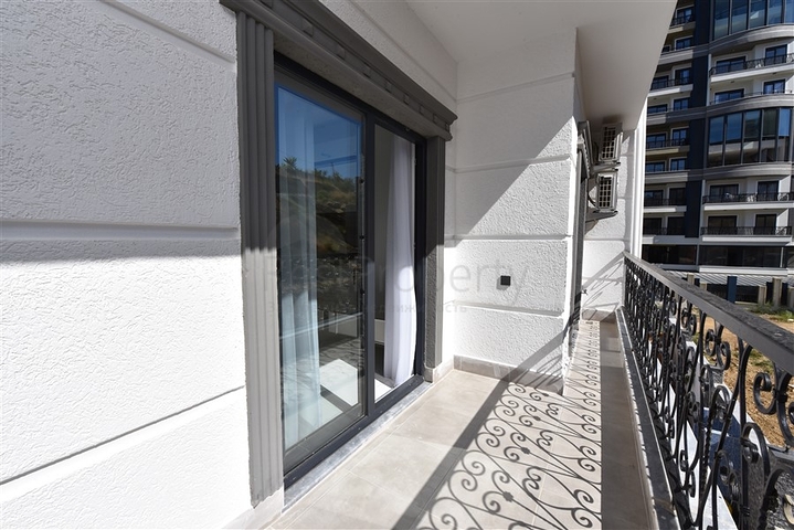 Двухкомнатная квартира в районе Махмутлар