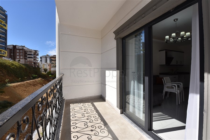 Двухкомнатная квартира в районе Махмутлар