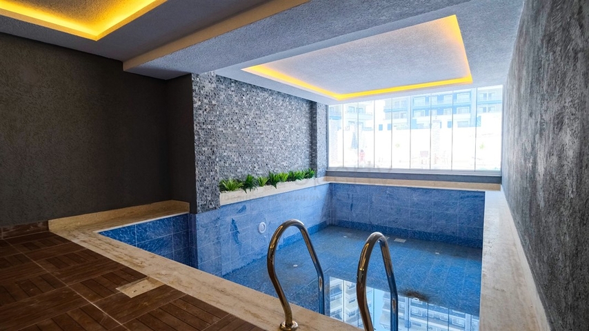 Двухкомнатная квартира в районе Махмутлар