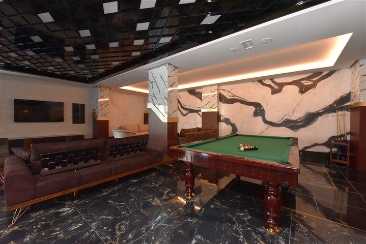 Трёхкомнатная квартира в премиальном жилом комплексе в районе Махмутлар