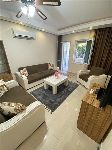 Квартира 1+1 в Махмутларе с выходом в сад