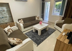 Квартира 1+1 в Махмутларе с выходом в сад