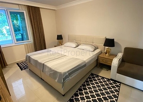 Квартира 1+1 в Махмутларе с выходом в сад