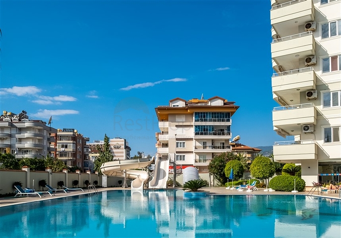 Апартаменты 2+1 в районе Тосмур в 200 м от моря 