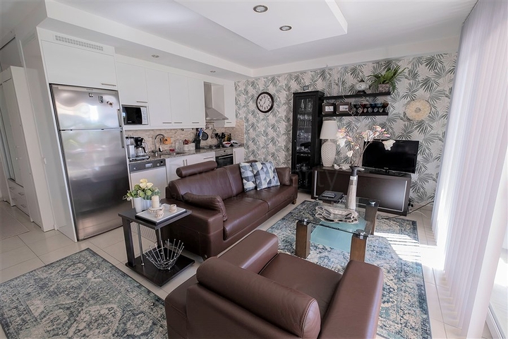 Просторная квартира с выходом в сад в районе Конаклы 