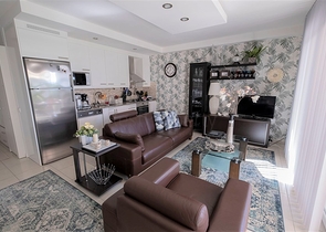 Просторная квартира с выходом в сад в районе Конаклы 