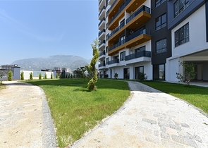 Апартаменты 1+1 в современном комплексе на побережье Средиземного моря  