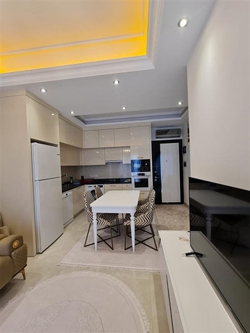 Двухкомнатная квартира в районе Махмутлар