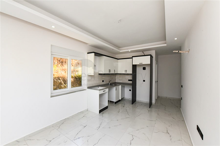 Квартира 1+1 в районе Конаклы в строящемся комплексе