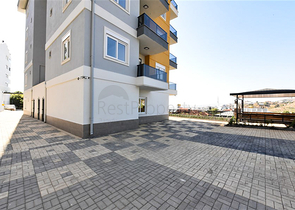 Квартира 1+1 в районе Конаклы в строящемся комплексе