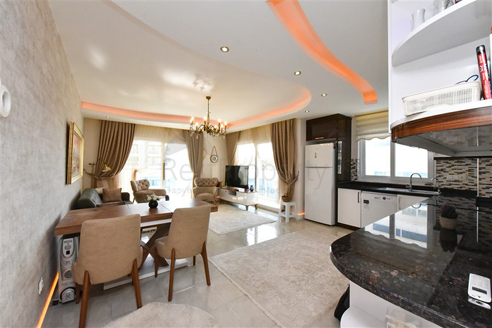 Квартира планировкой 2+1 в районе Махмутлар 