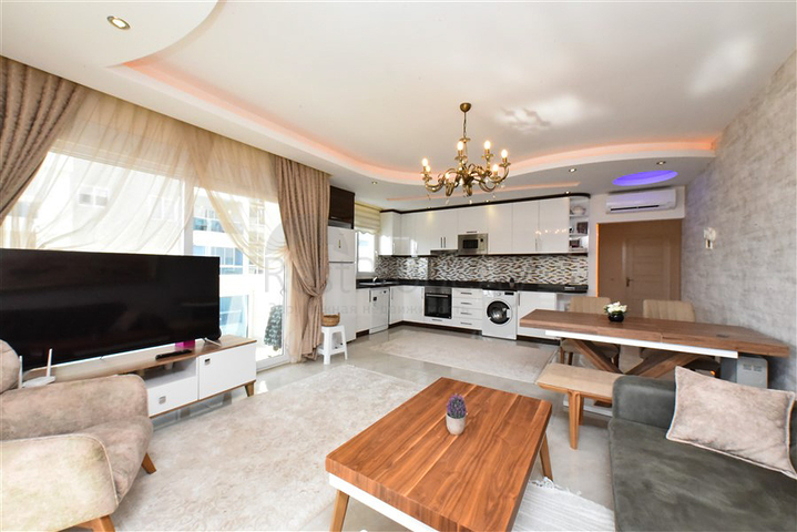 Квартира планировкой 2+1 в районе Махмутлар 