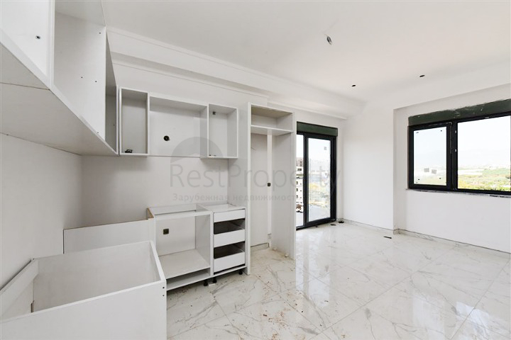 Квартира 1+1 в новом доме в районе Махмутлар