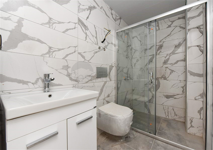 Квартира 1+1 в новом доме в районе Махмутлар