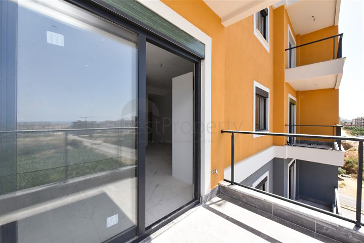 Квартира 1+1 в новом доме в районе Махмутлар