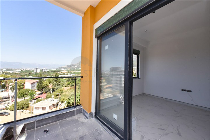 Квартира 1+1 в новом доме в районе Махмутлар