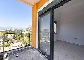 Квартира 1+1 в новом доме в районе Махмутлар