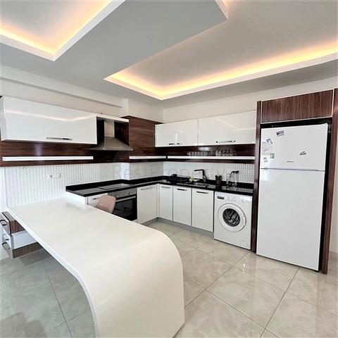 Квартира 1+1 в районе Махмутлар 