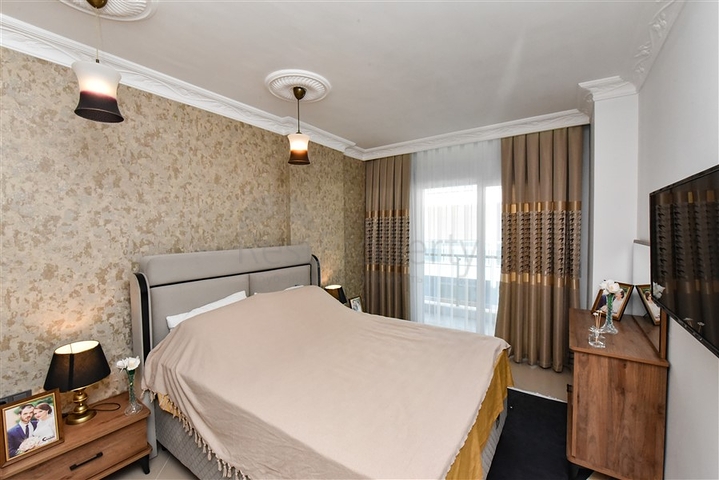 Красивая квартира в резиденции у моря в районе Махмутлар.