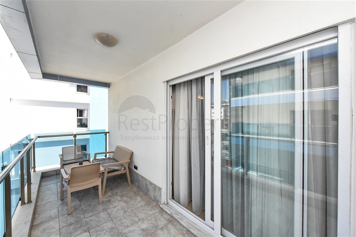 Красивая квартира в резиденции у моря в районе Махмутлар.